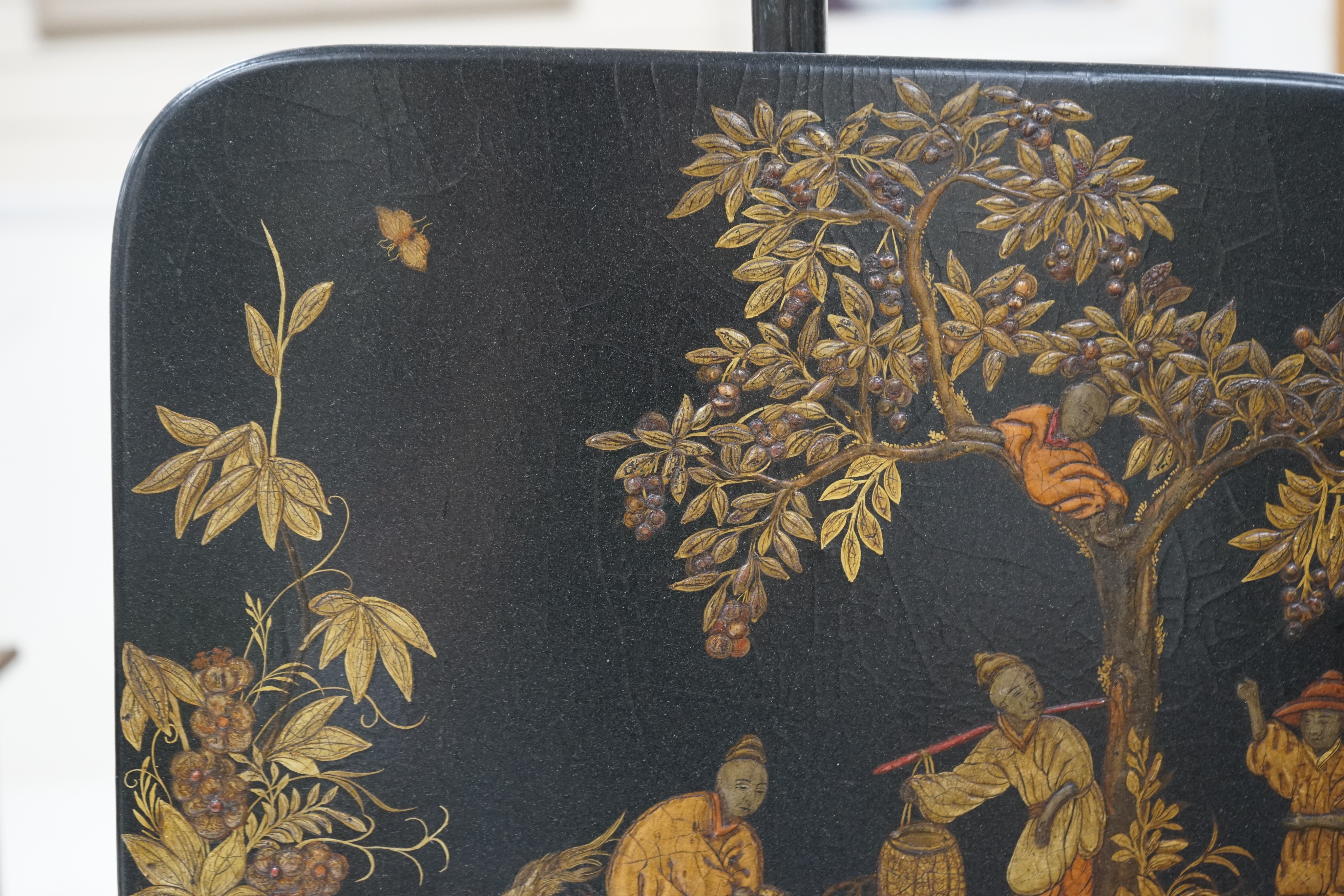A pair of 19th century chinoiserie lacquer pole screens, height 152cm